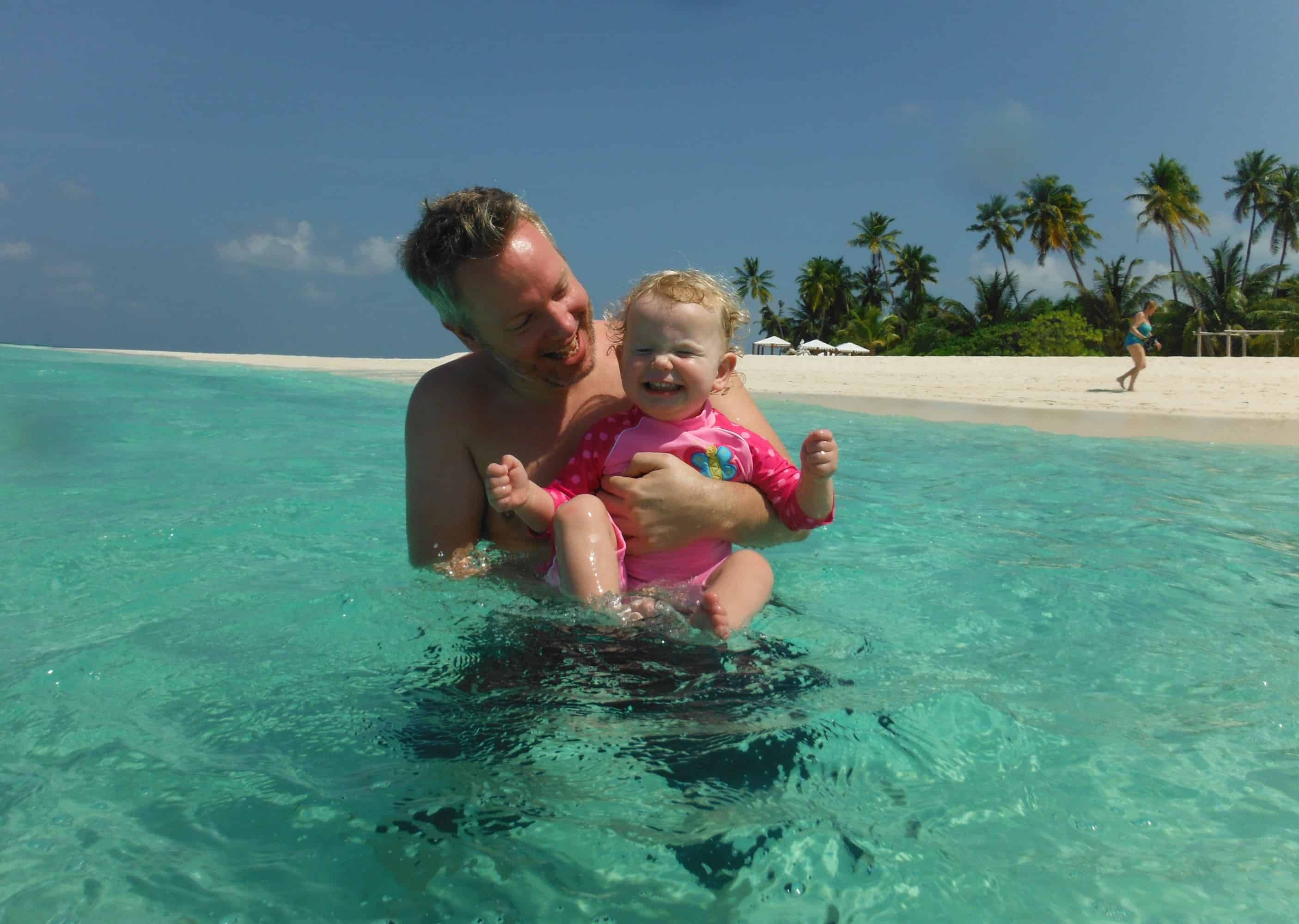 Family holiday Maldives Edie Melissa Young child and father in the turquoise sea on a family holiday to the Maldives