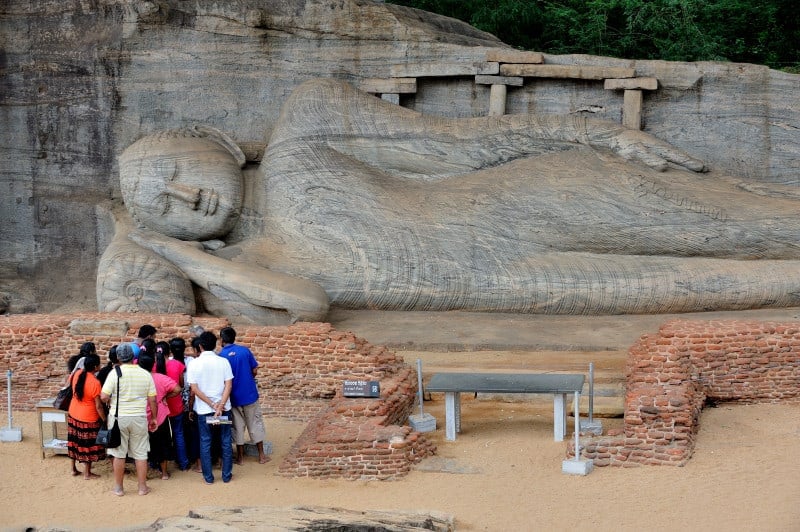 Sri Lanka - Buddha a Gal Viharaya, Polonnaruwa A crowd of Sri lankan tourists stood in front of Gal Vihara rock temple
