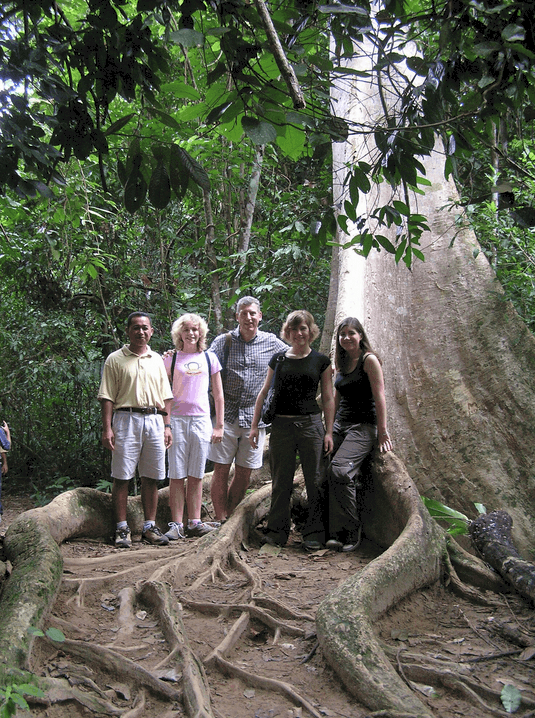 Becky Grainger family Asia A family in Taman Negara in Malaysia under a huge tree