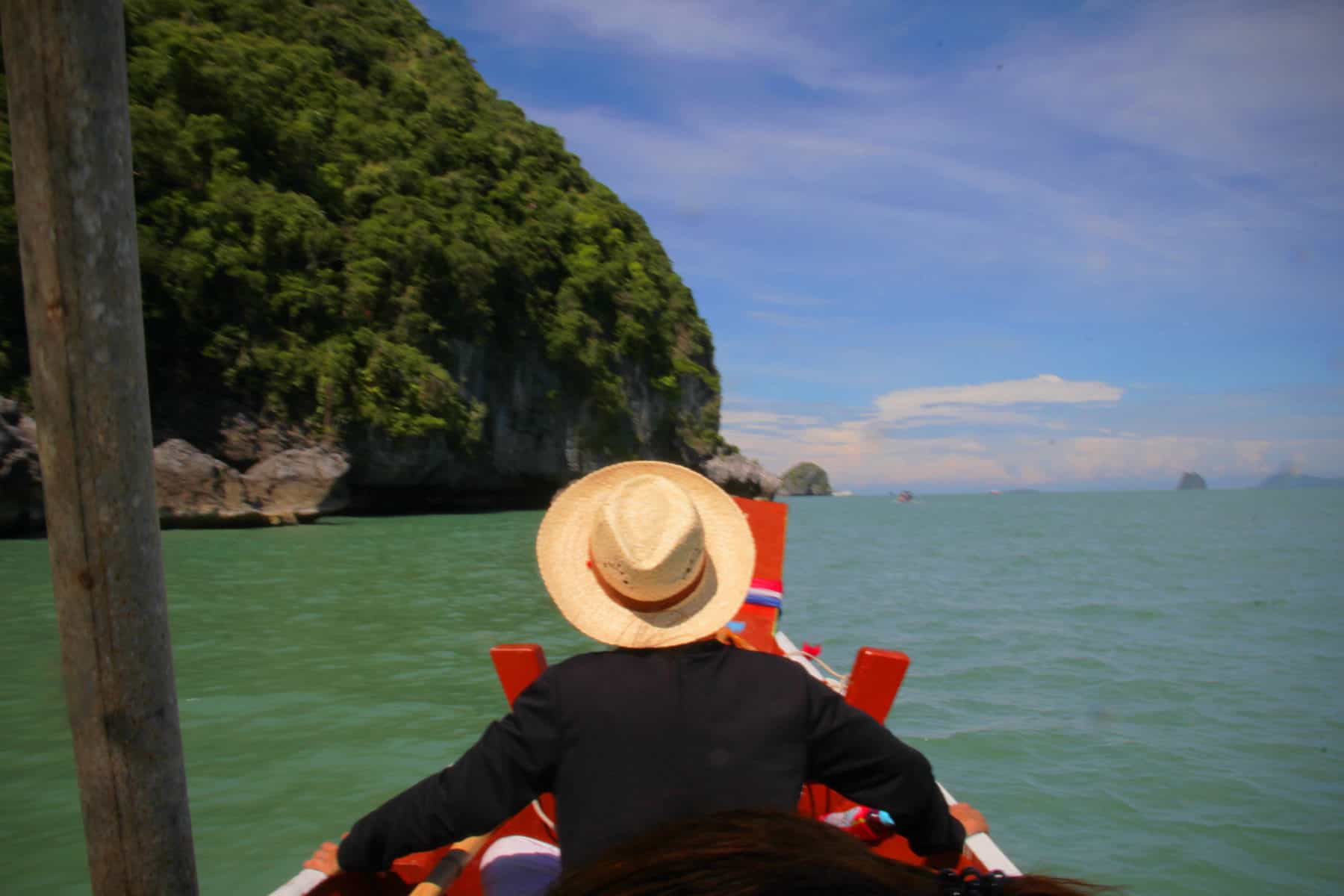 Khanom Seaboat2 EDIT man sitting on a boat in Khanom in Thailand