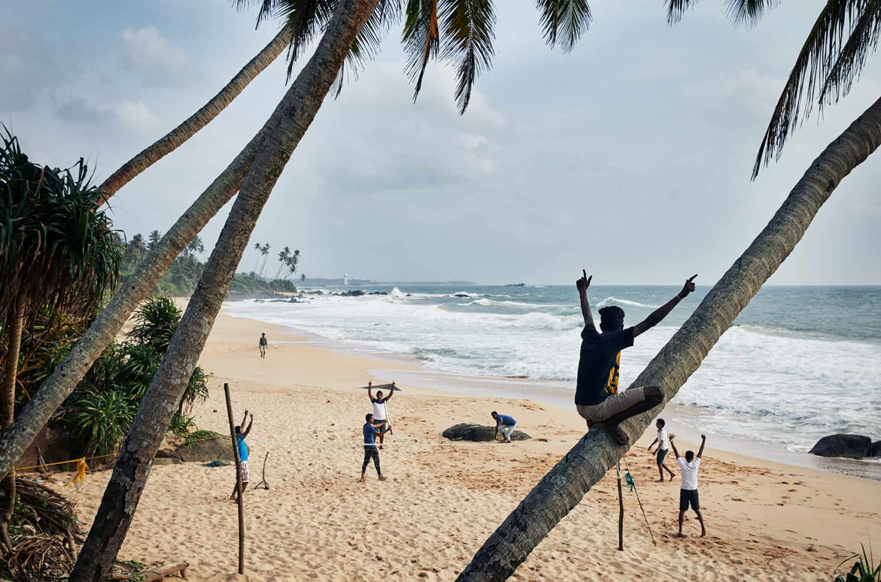 Cricket Beach Sri Lanka Locals having fun playing cricket on a Sri Lankan Beach