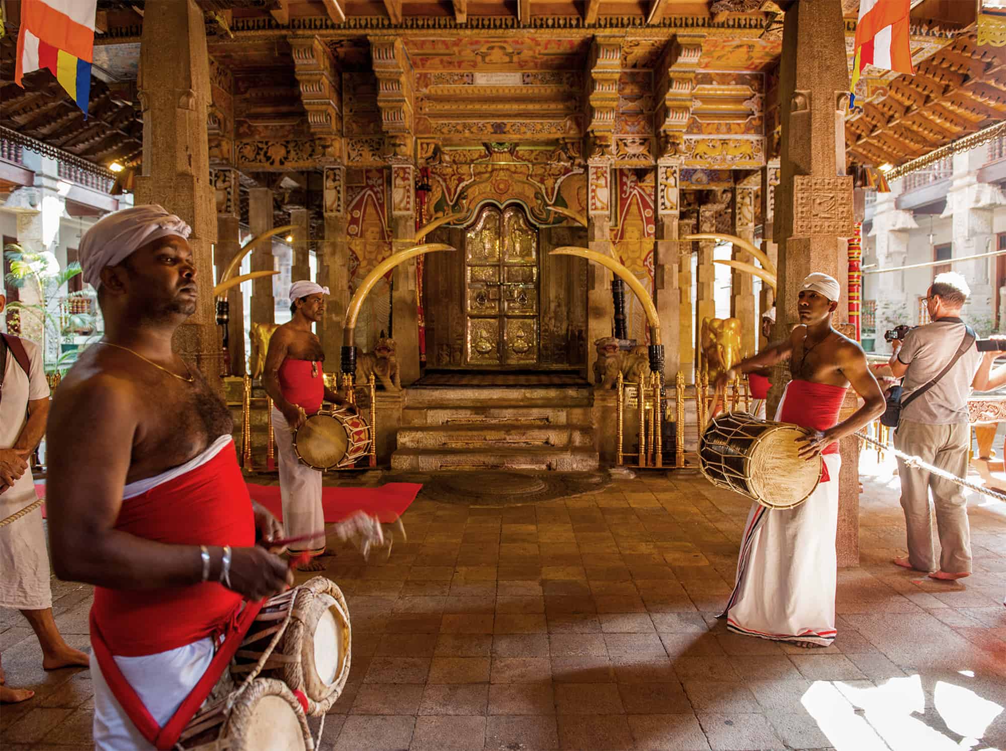 Kandy Temple of the Tooth 1 Worshippers with drums in the temple of the tooth
