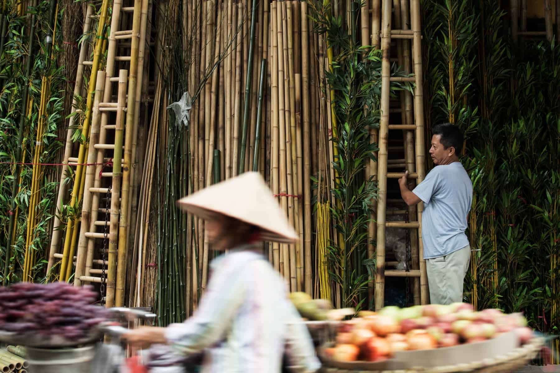 Vietnam market A market in Vietnam - a local pushing bike with traditional conical hat on