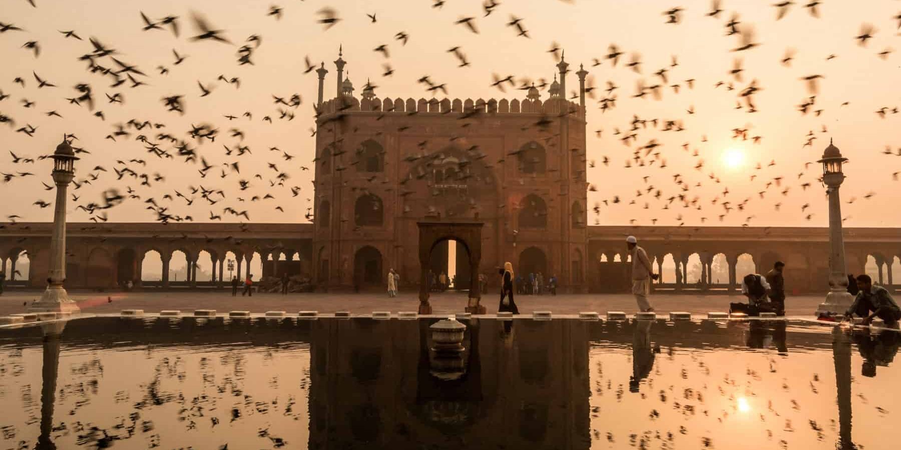 Reflection of Jama masjid, Old Delhi india during sunrise with Jama Masjid at sunrise in Delhi, Northern India