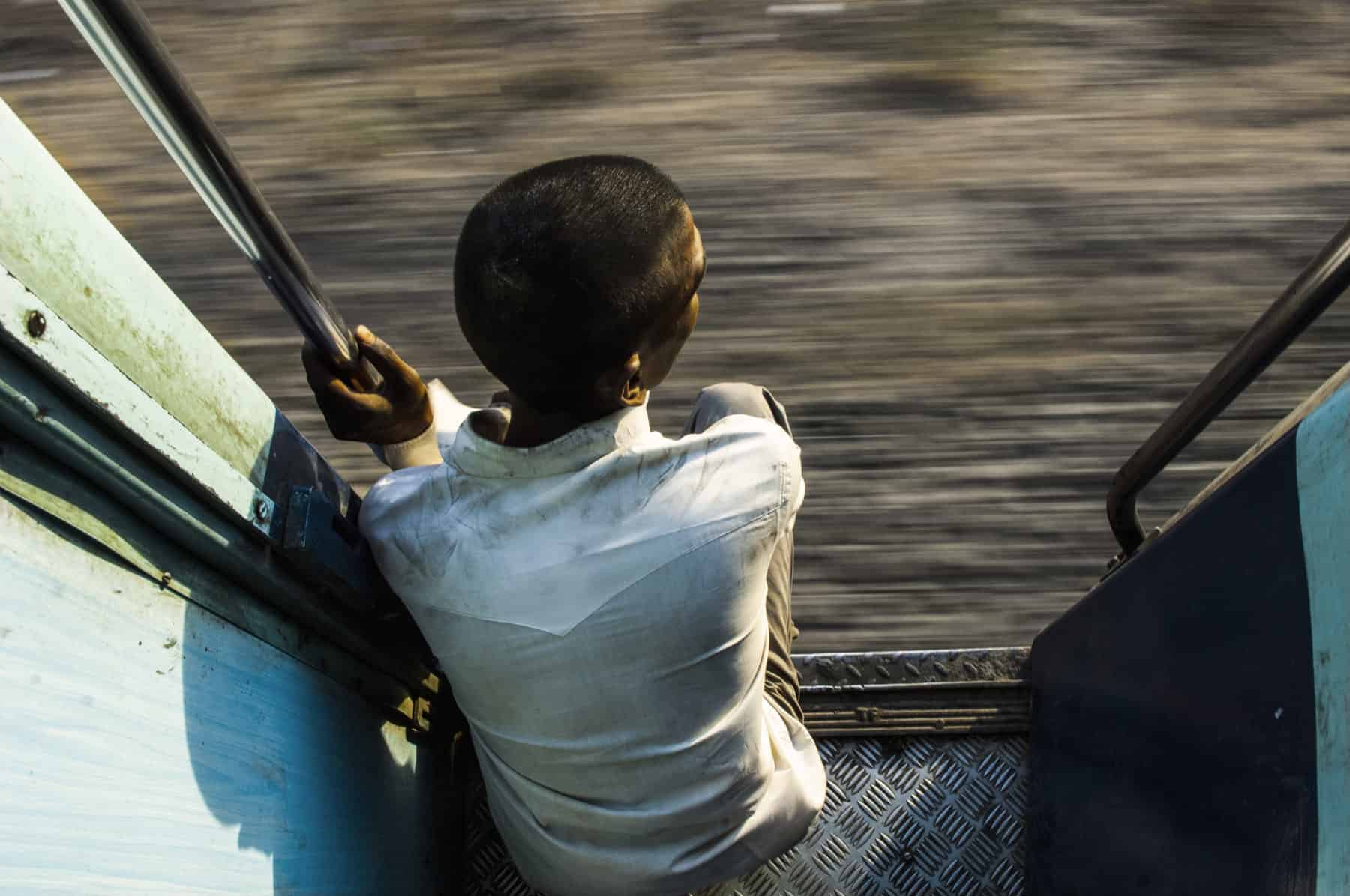 a passenger in a train looking outside, india a passenger in a train looking outside, india