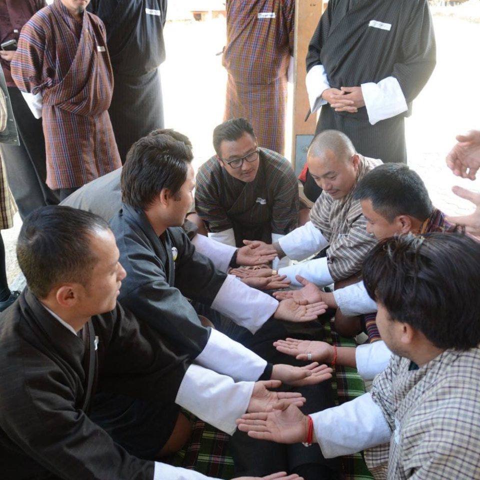 Bhutan Men praying in Bhutan