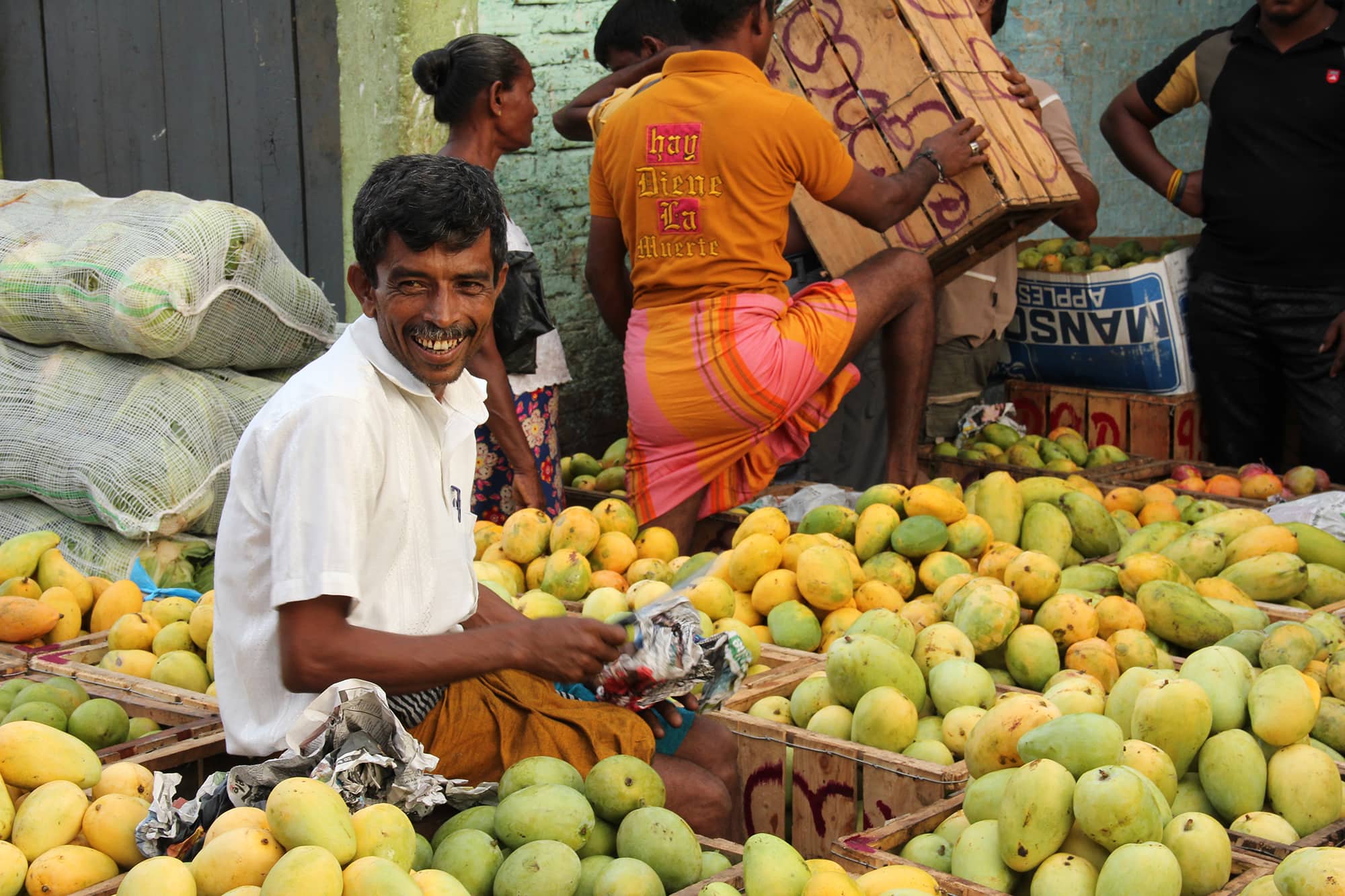 Fruit blog header Mango trader in Sri Lanka with a smile on his face
