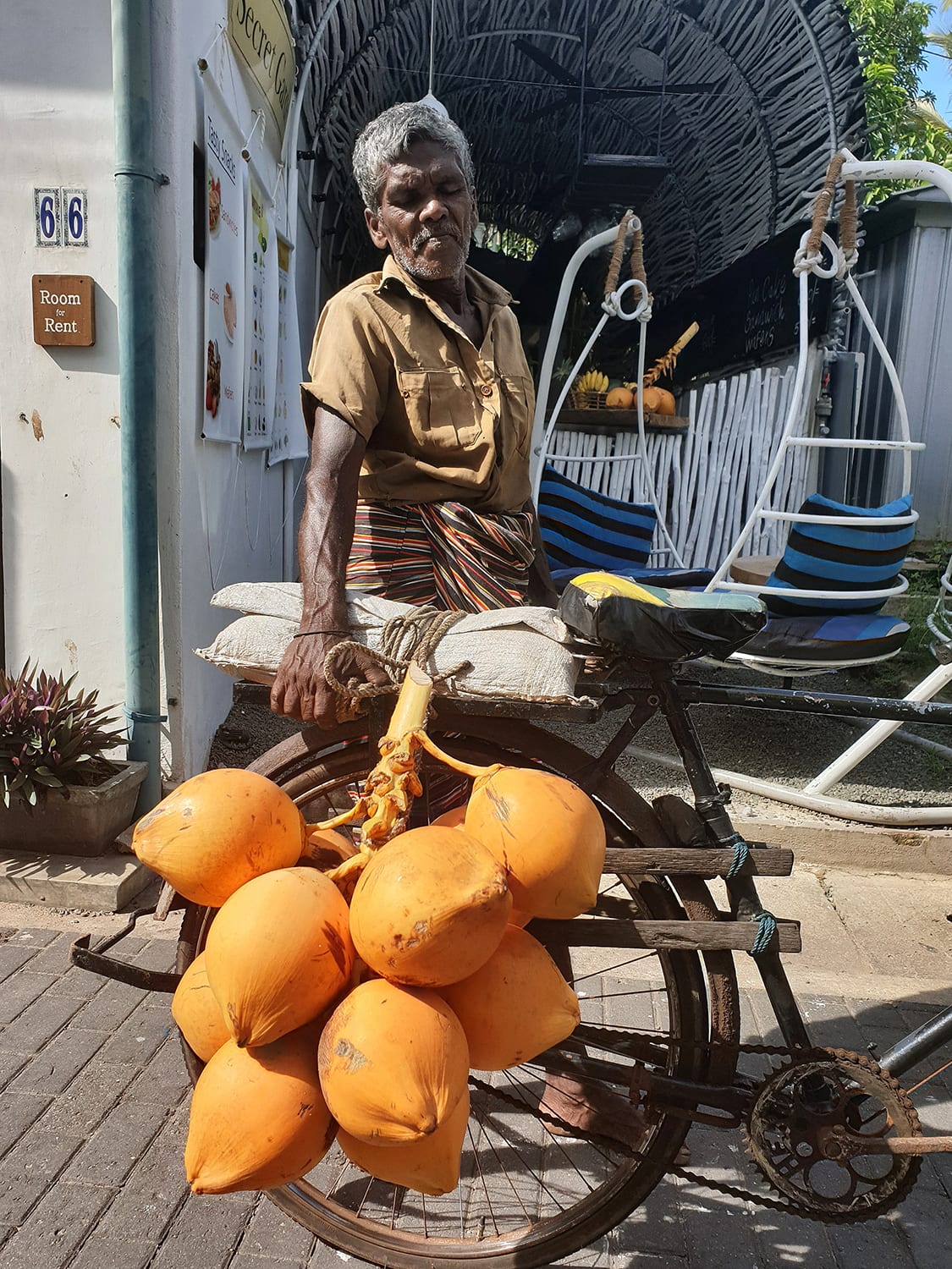 Mango Mango trader in Sri Lanka with an old bike