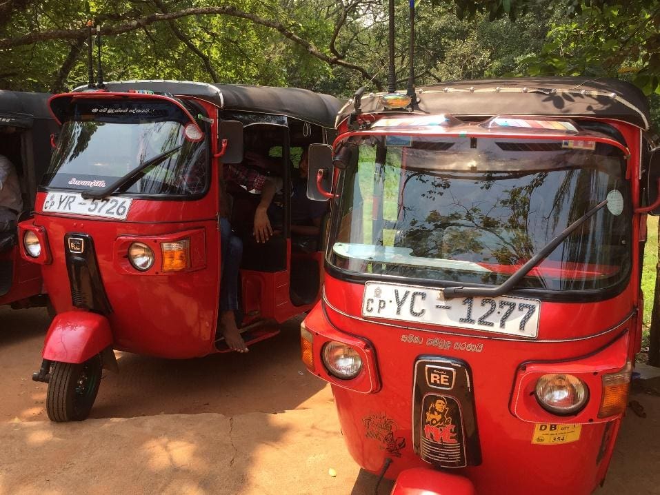 Sri-Lankan-Tuk-Tuks Two red tuk tuks in Sri Lanka