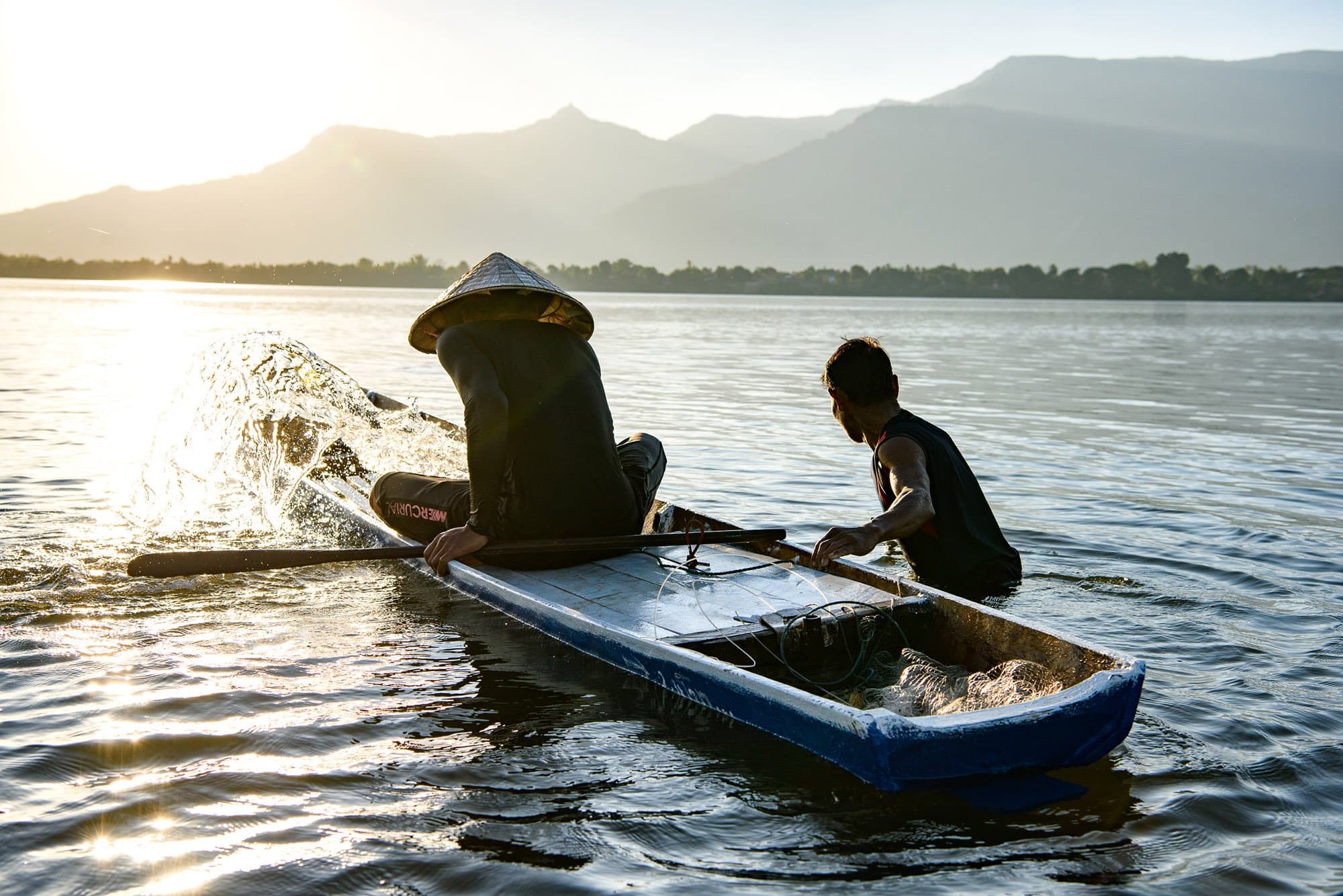 Laos - Don Daeng - 2019- 0013 - Reduced Size Fishermen pushing out their boat from Don Daeng in Laos at sunrise