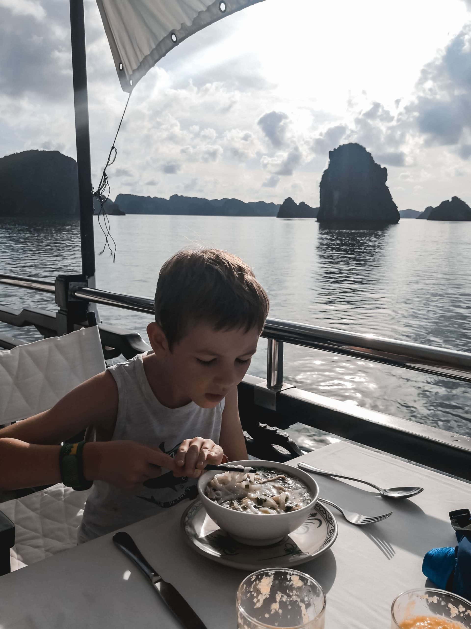Children Food Vietnam Having lunch whilst cruising Ha Long Bay on a family holiday to Vietnam