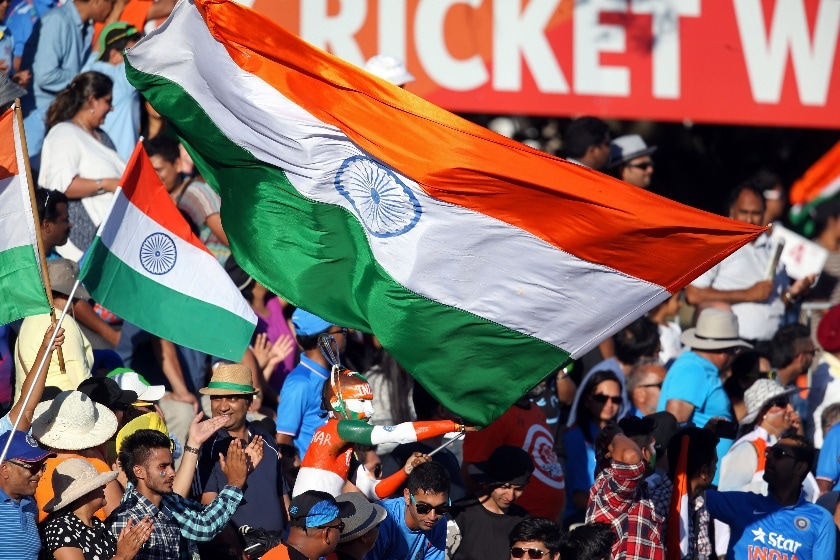 India Cricket the atmosphere in a cricket stadium in India can be incredible. India fans wave a huge flag as they celebrate