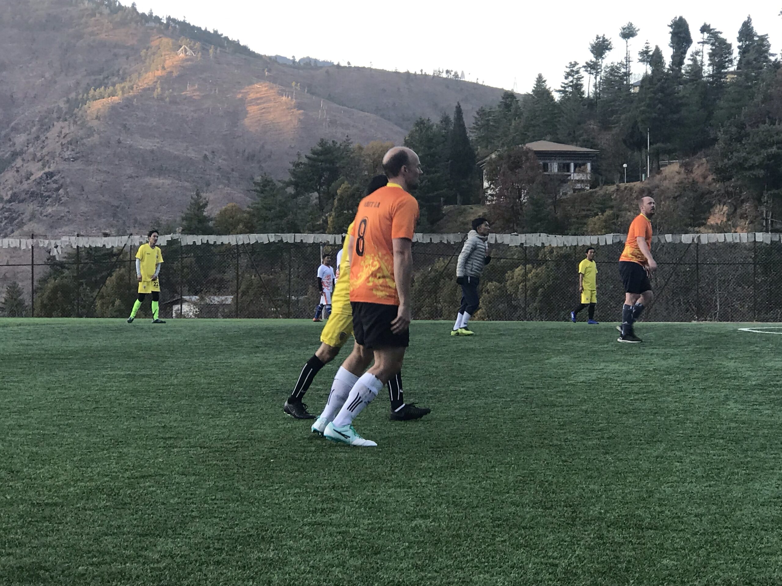 Matt and James on the football pitch A football match in Bhutan