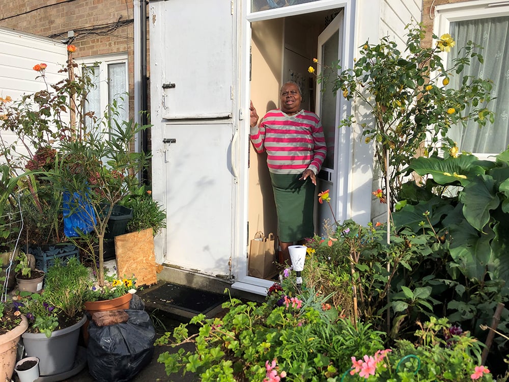 Pauline Regenerate RISE Woman standing at doorway in garden