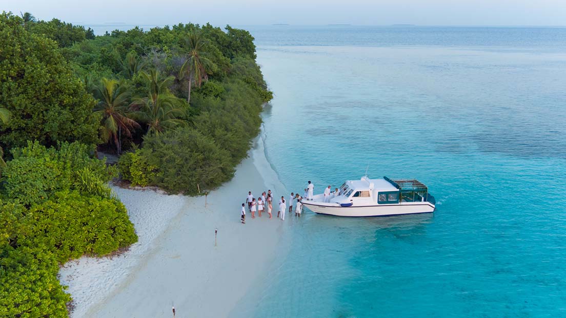Soneva Fushi boat trip Boat on the beachside with travellers from Soneva Fushi island in the Maldives
