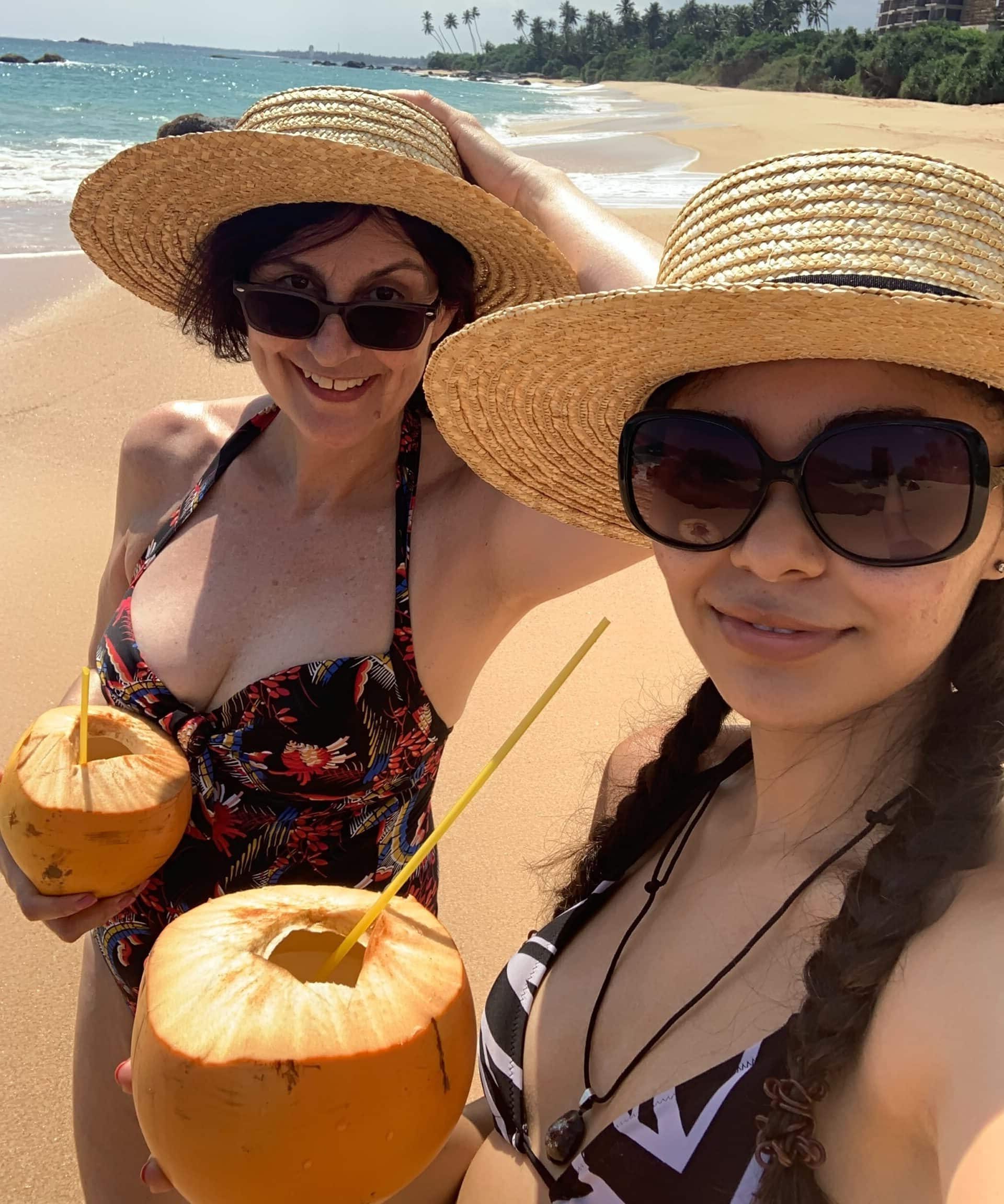Jess and Karen enjoying kings coconuts on the beach in Sri Lanka Jess and Karen enjoying kings coconuts on the beach in Sri Lanka