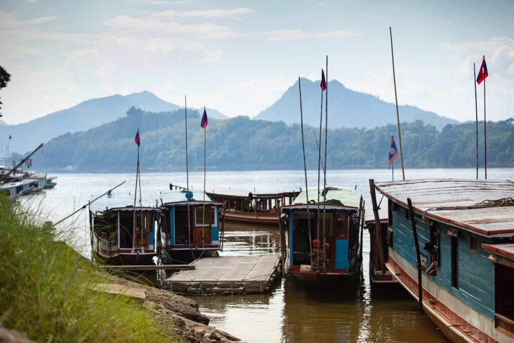 Boats on the Mekong river, Laos Boats on the Mekong river, Laos
