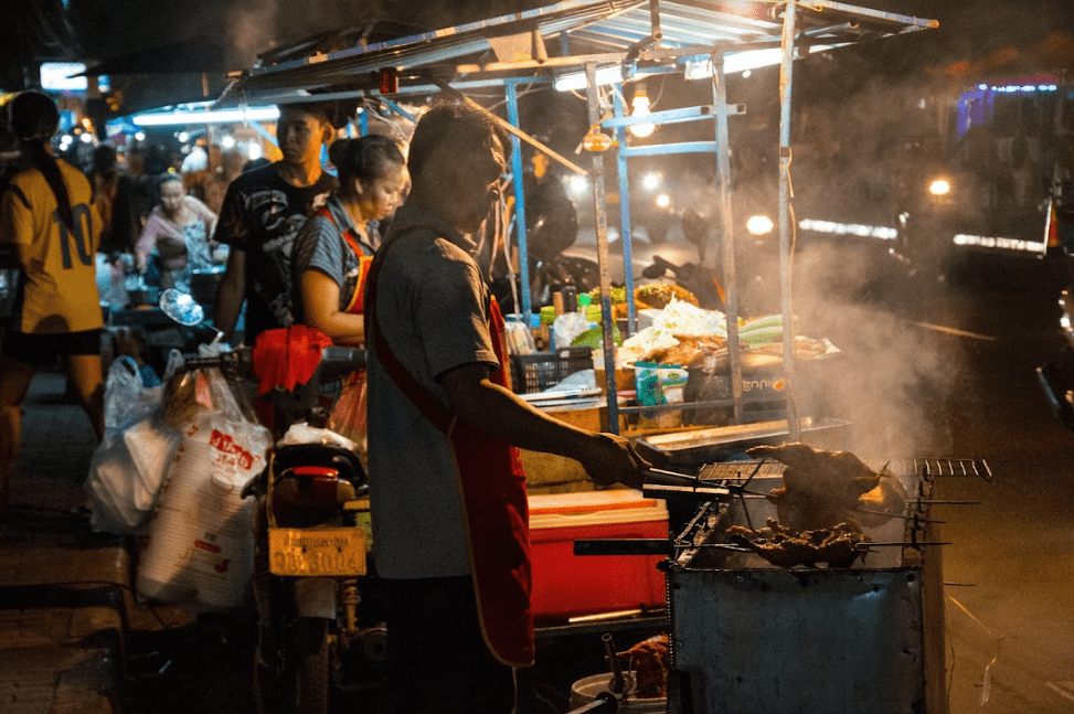 Street food trader in Laos Street food trader in Laos