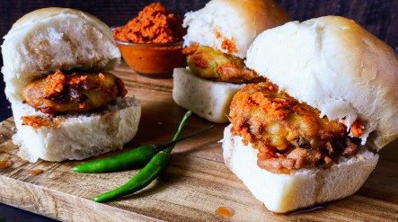 Three Vada Pav Indian style patty in a bun Three Vada Pav Indian style patty in a bun