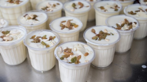 Cups of Lassi, is an Indian yoghurt drink, decorated with nuts and dried fruit Cups of Lassi, is an Indian yoghurt drink, decorated with nuts and dried fruit