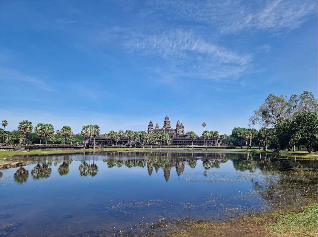 View of the Angkor Wat temple’s iconic 5 turrets from across the lake View of the Angkor Wat temple’s iconic 5 turrets from across the lake