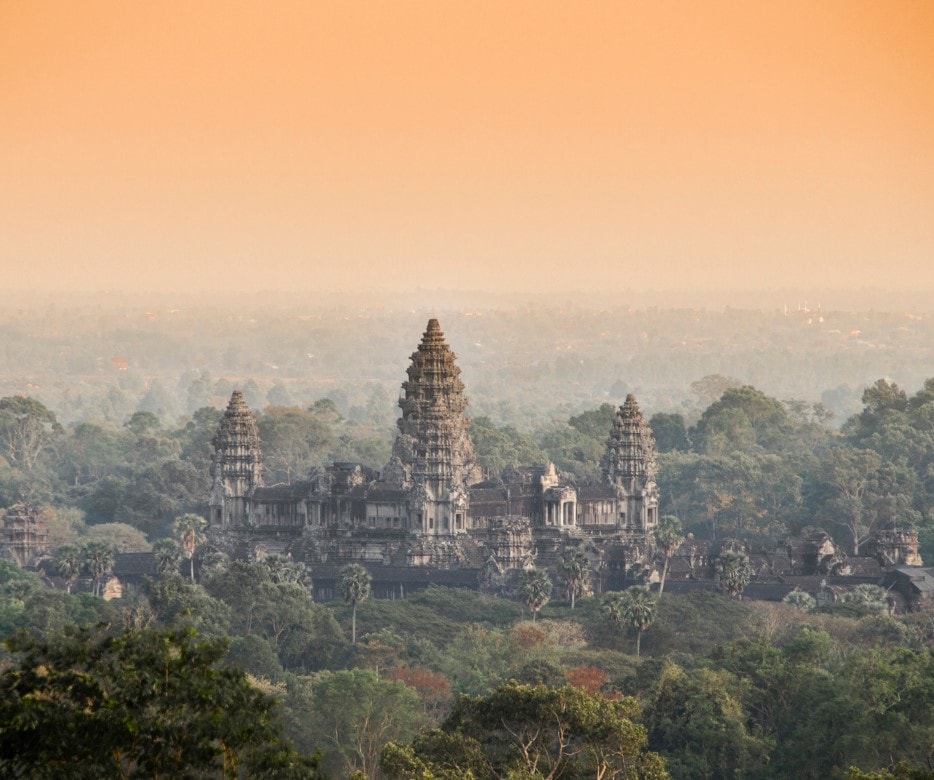 Angkor Wat temple with a hazy yellow sky. Angkor Wat temple with a hazy yellow sky.