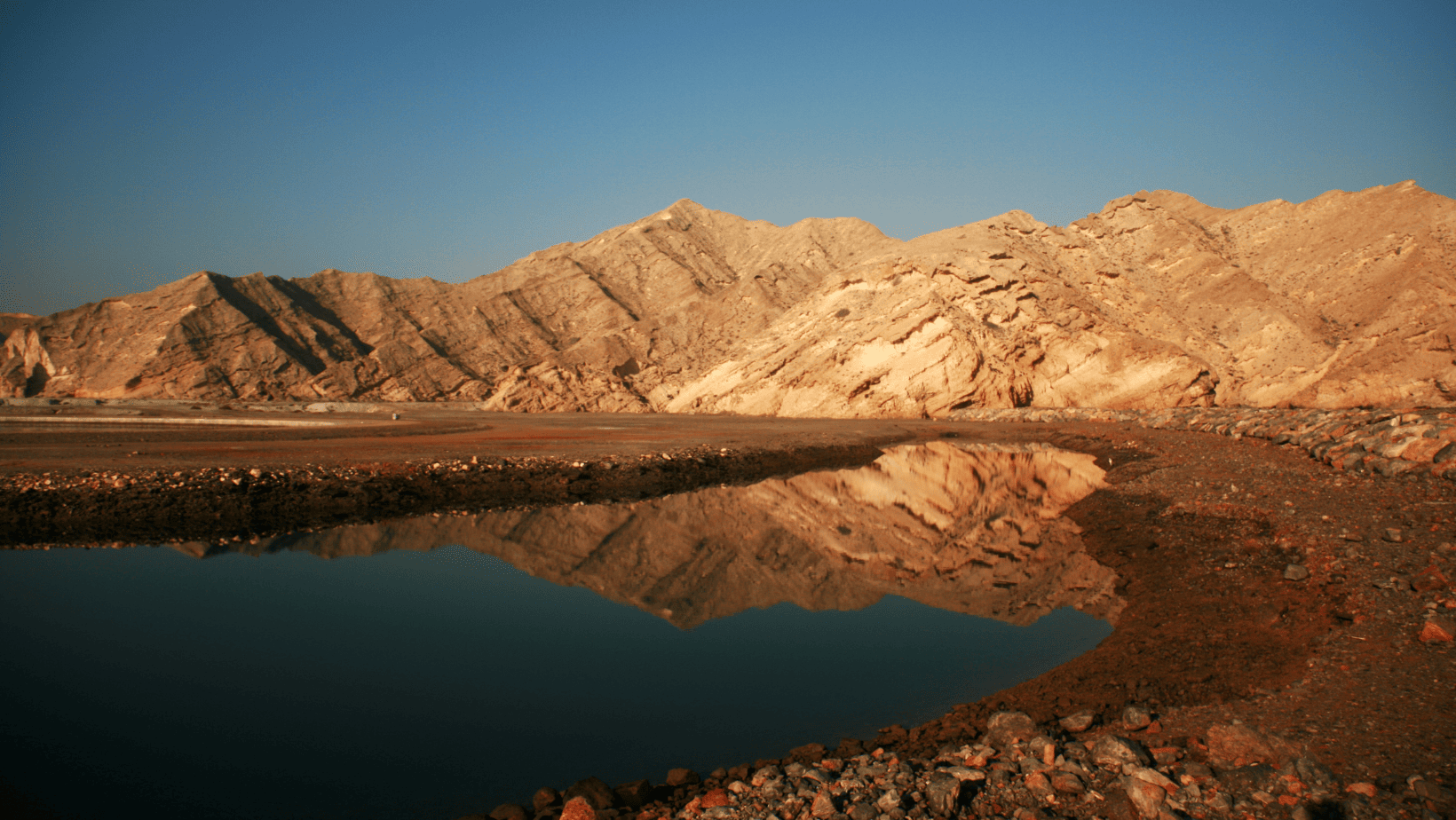 Oman Beaches (6) Reflection of hills on water in Yiti Beach, Oman