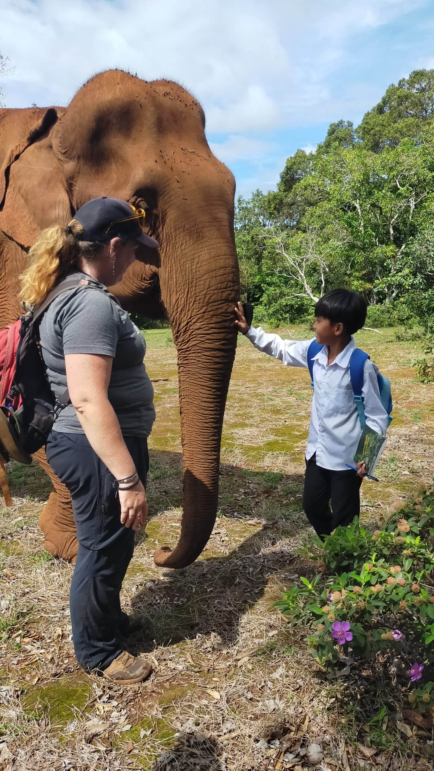 Cambodia trip (3) A child experiences meeting an elephant under supervision from an adult at Elephant Valley Project, Mondulkiri, Cambodia