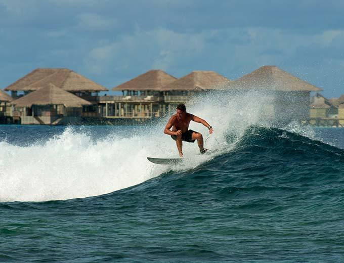 Surfing at Six Senses Laamu